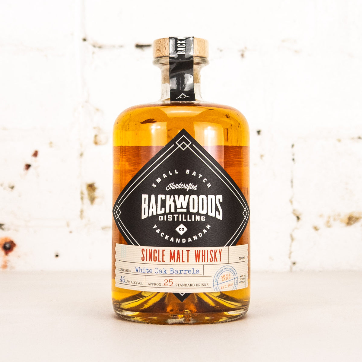 Backwoods Single Malt Whisky bottle on a light background